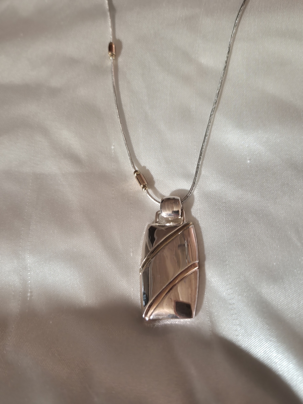 Carolina Herrera CH Silver Tone Pendant Necklace